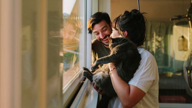 young couple and cat