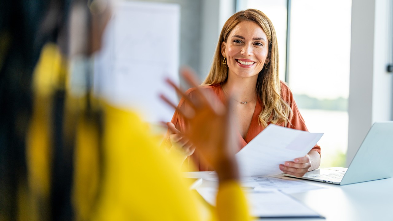 Office manager talks to the new intern