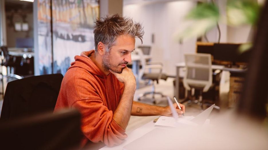 Image of a computer developer getting back to the office after the coronavirus pandemic is over.