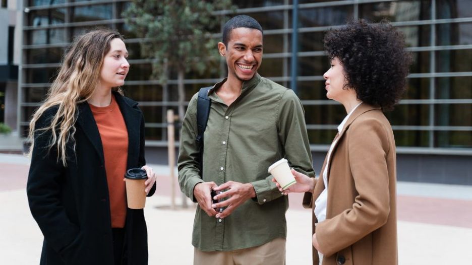 young business people having a conversation on the street.
